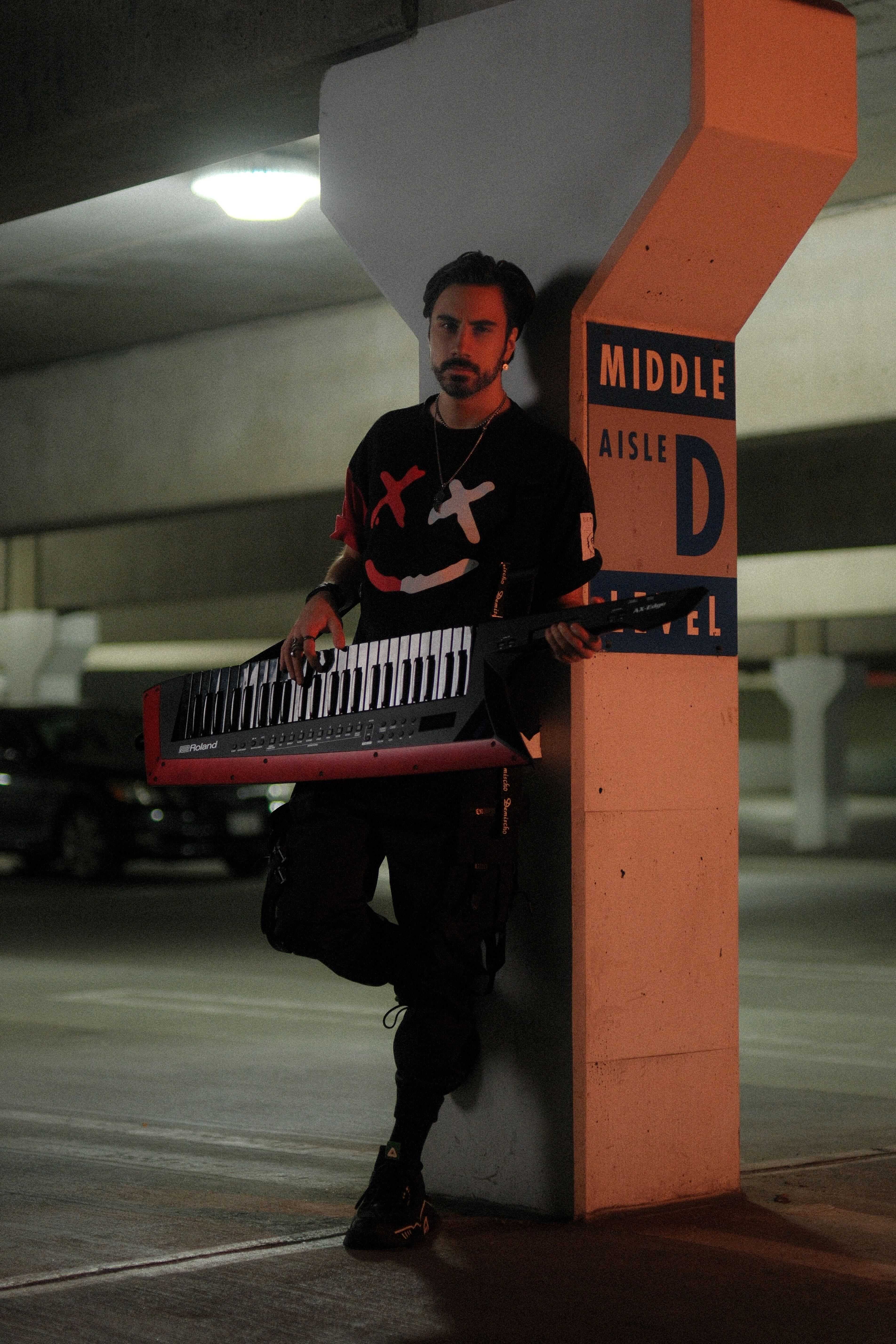 Daniel Michael full body shot + keytar leaning against wall "Need You" photoset